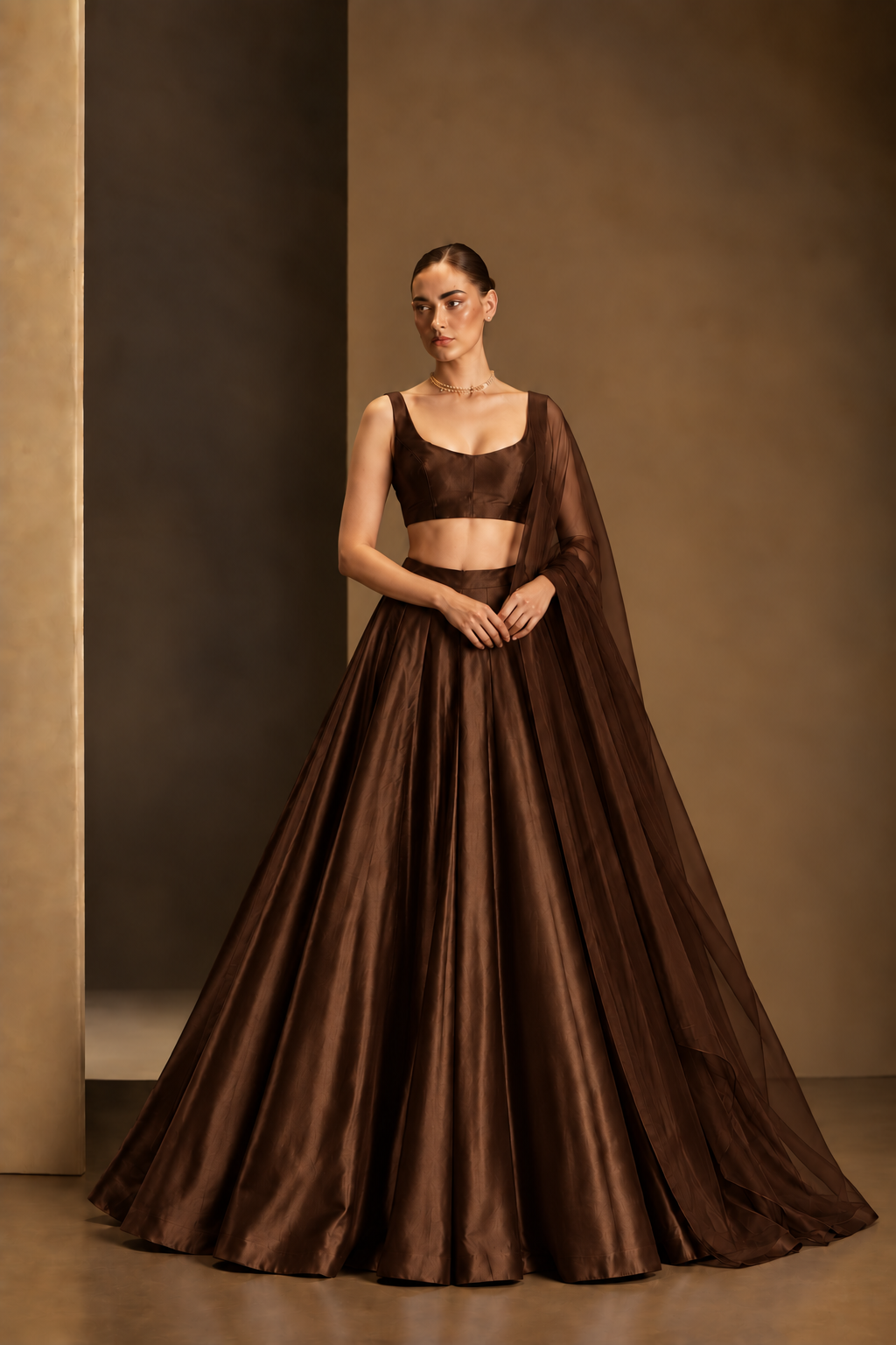 Dark Chocolate Brown plain lehenga with sleeveless choli and matching sheer dupatta