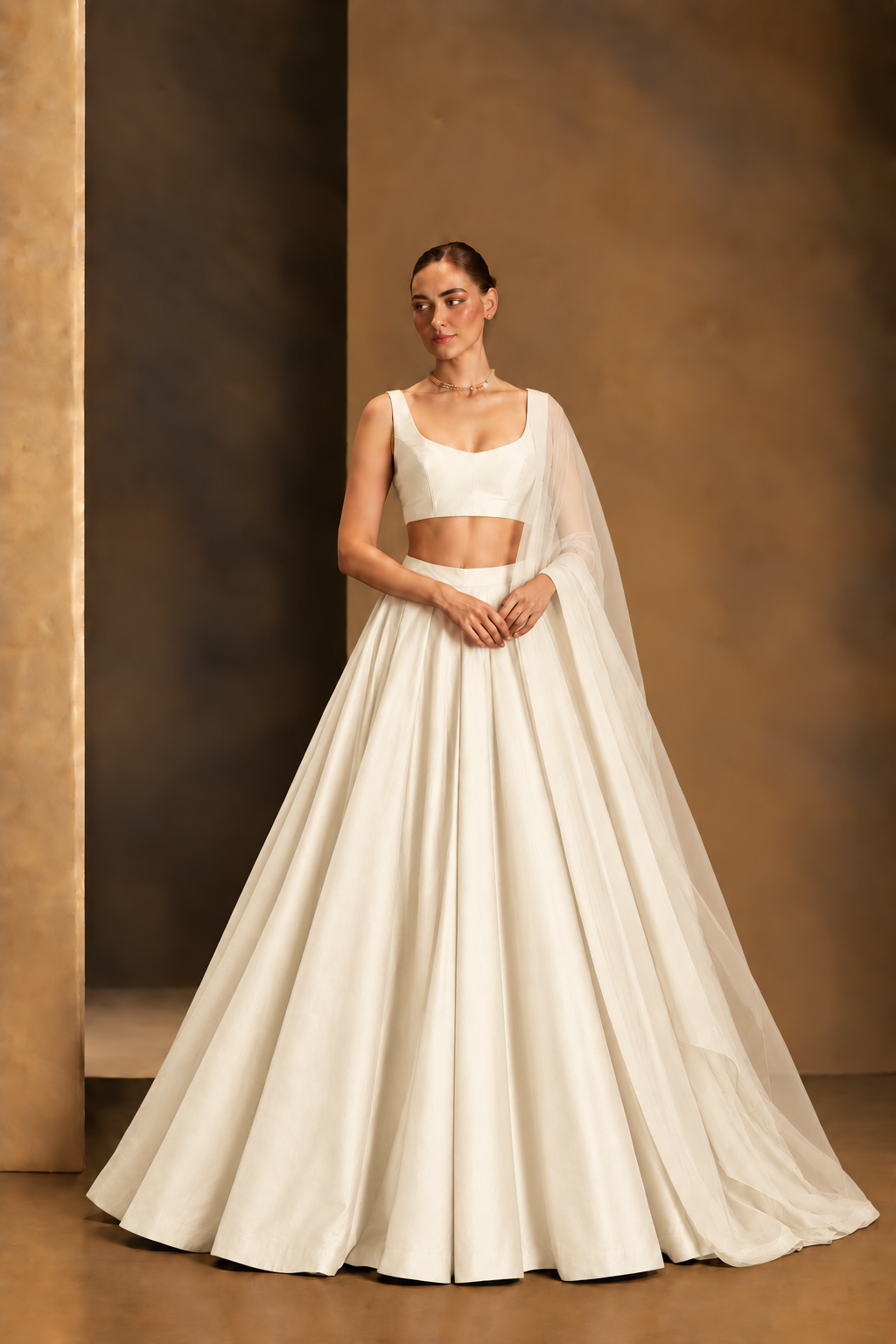 Off-White plain lehenga with sleeveless choli and matching sheer dupatta